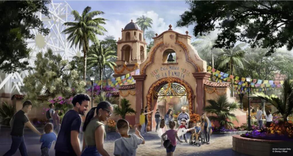Concept art of the entrance to the upcoming Coco attraction at Disney California Adventure, showing Casa Museo de la Familia with papel picado, marigold garlands, and families entering a colorful plaza.