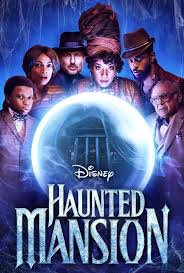 Ensemble poster for Disney’s 2023 “Haunted Mansion,” crystal ball at center with the mansion glowing in eerie blue behind the cast.