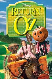 “Return to Oz” poster—Dorothy with Jack Pumpkinhead, Tik-Tok, and the Gump on the yellow brick road beneath a big green title.