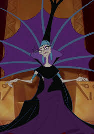 Yzma sits on a throne with a huge purple collar, hands raised, scowling.